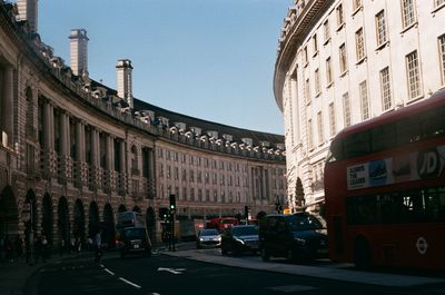 Street amidst buildings in city against sky