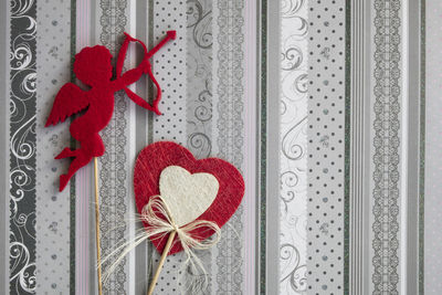 Close-up of red heart shape hanging on door