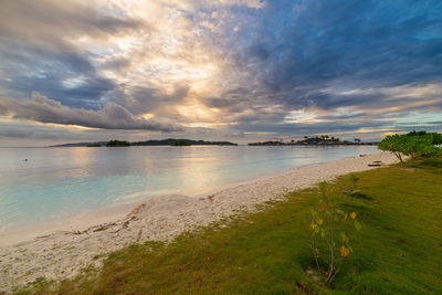 Scenic view of sea against cloudy sky