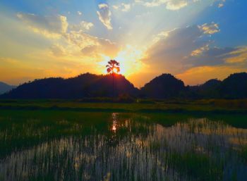 Scenic view of lake against sky during sunset