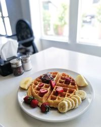 Close-up of breakfast served on table