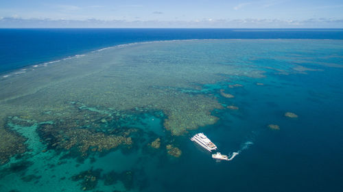 High angle view of ship sailing in sea against sky