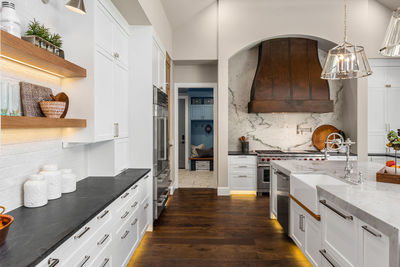 Kitchen in luxury home with large island and hardwood floors