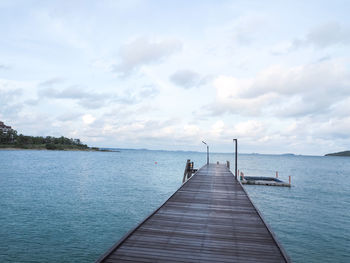 Pier over sea against sky