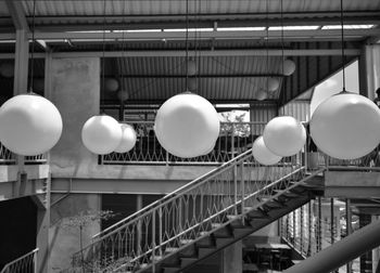 Low angle view of balloons hanging on ceiling of building