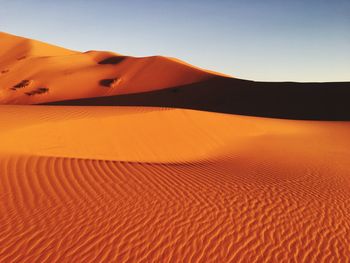 Scenic view of desert against clear sky