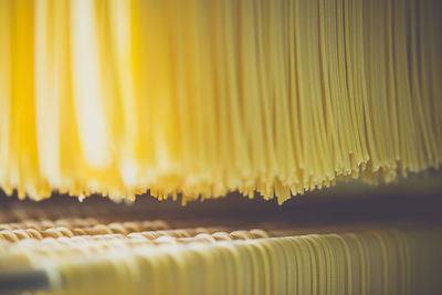 Full frame shot of spaghetti drying in factory