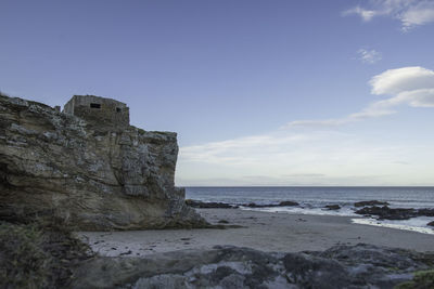 Scenic view of sea  and bunker against sky