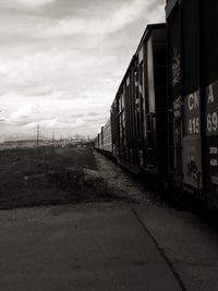 Train on railroad track against sky