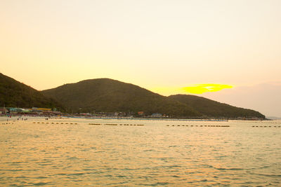 Scenic view of sea against clear sky during sunset