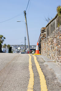 Surface level of road against sky in city