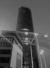 Low angle view of modern buildings against sky at night