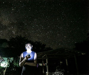 Woman standing at night