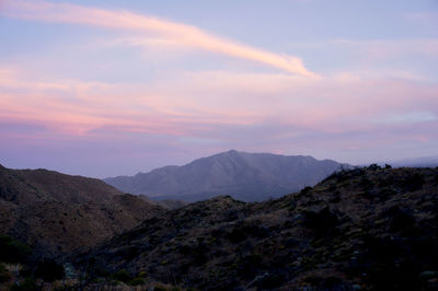 Scenic view of mountains against sky at sunset