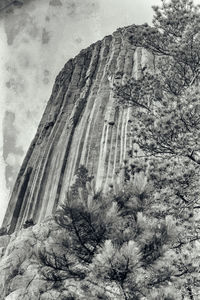 Low angle view of rock formations against sky