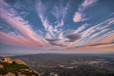 Aerial view of townscape against sky during sunset