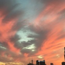 Low angle view of cloudy sky at sunset