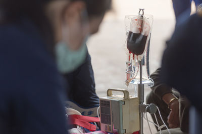 Close-up of people holding drink