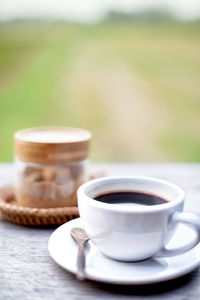 Close-up of coffee cup on table