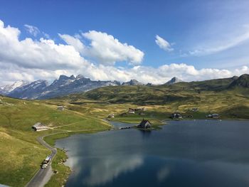 Scenic view of lake and mountains against sky