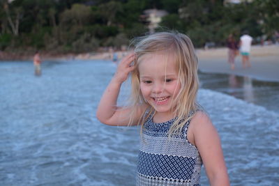 Portrait of smiling girl in water