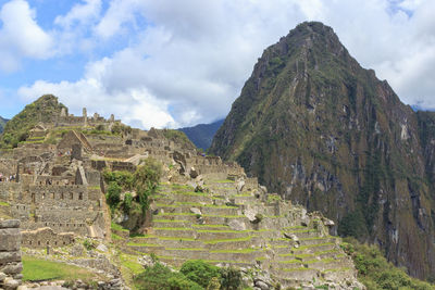 Scenic view of mountain against cloudy sky