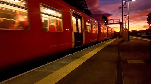 Train at railroad station against sky