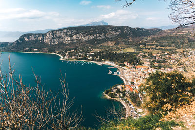 High angle view of townscape by sea against sky
