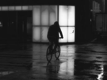 Rear view of woman walking on street