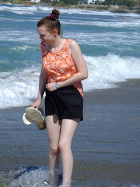 Woman standing in sea