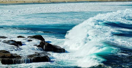 Waves splashing on rocks