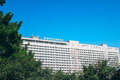 Low angle view of buildings against blue sky