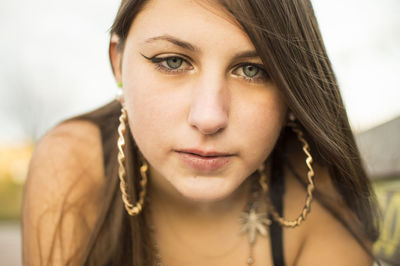 Close-up portrait of beautiful young woman with long hair