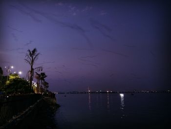 Scenic view of sea against sky at night