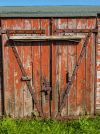 Old wooden gate on field