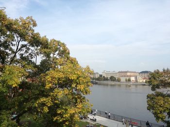 View of bridge over river against cloudy sky