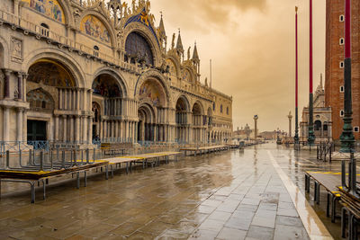 View of wet cathedral against sky during rainy season