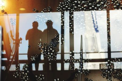 Defocused image of people in illuminated city