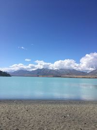 Scenic view of sea against blue sky