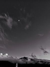 Low angle view of moon against sky at night