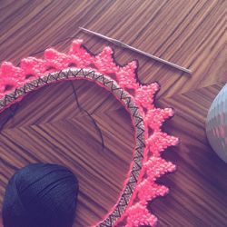 Close-up of crocheting item on table