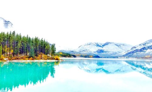 Scenic view of lake with mountains in background