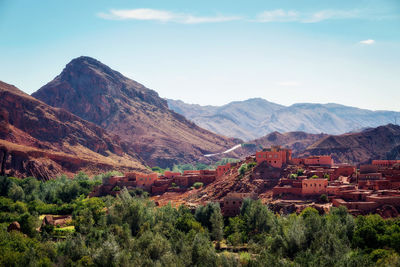 Scenic view of landscape and mountains against sky