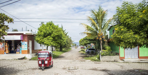 Tuk tuk driving on street in monjas, guatemala