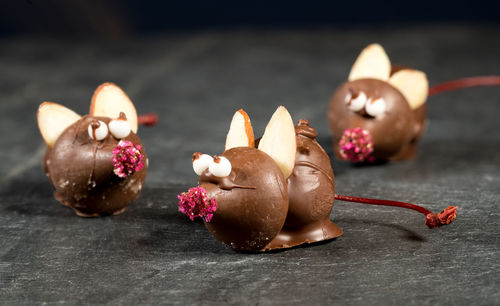 Close-up of dessert in rat shape on table