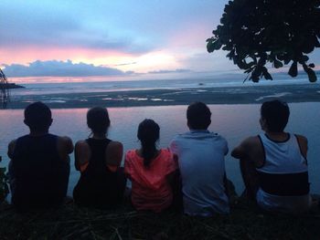 Rear view of silhouette people on beach