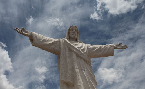 Low angle view of statue against sky