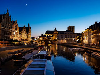 Reflection of illuminated buildings in canal at night