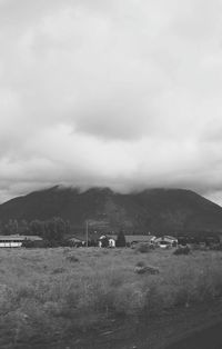 Scenic view of mountains against cloudy sky