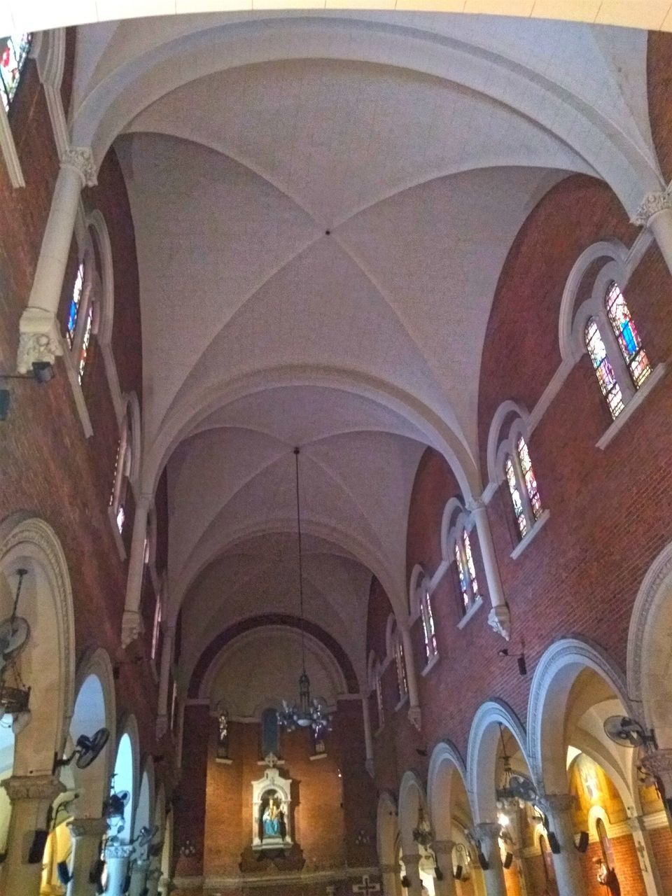 LOW ANGLE VIEW OF ILLUMINATED CEILING OF BUILDING AT TEMPLE